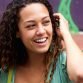 happy-young-woman-sitting-on-steps-with-a-mobile-PR4TN3M happy-young-woman-sitting-on-steps-with-a-mobile-PR4TN3M